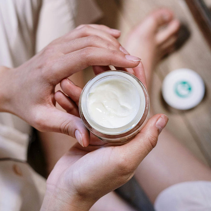 Female holding moisturizer